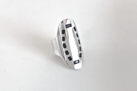 Large sterling sterling ring with square piercing enhanced with black patina